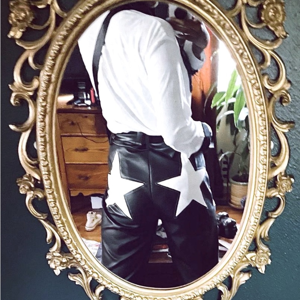 Star bottom black high-waisted, tapered, faux leather pants. Size US 10.